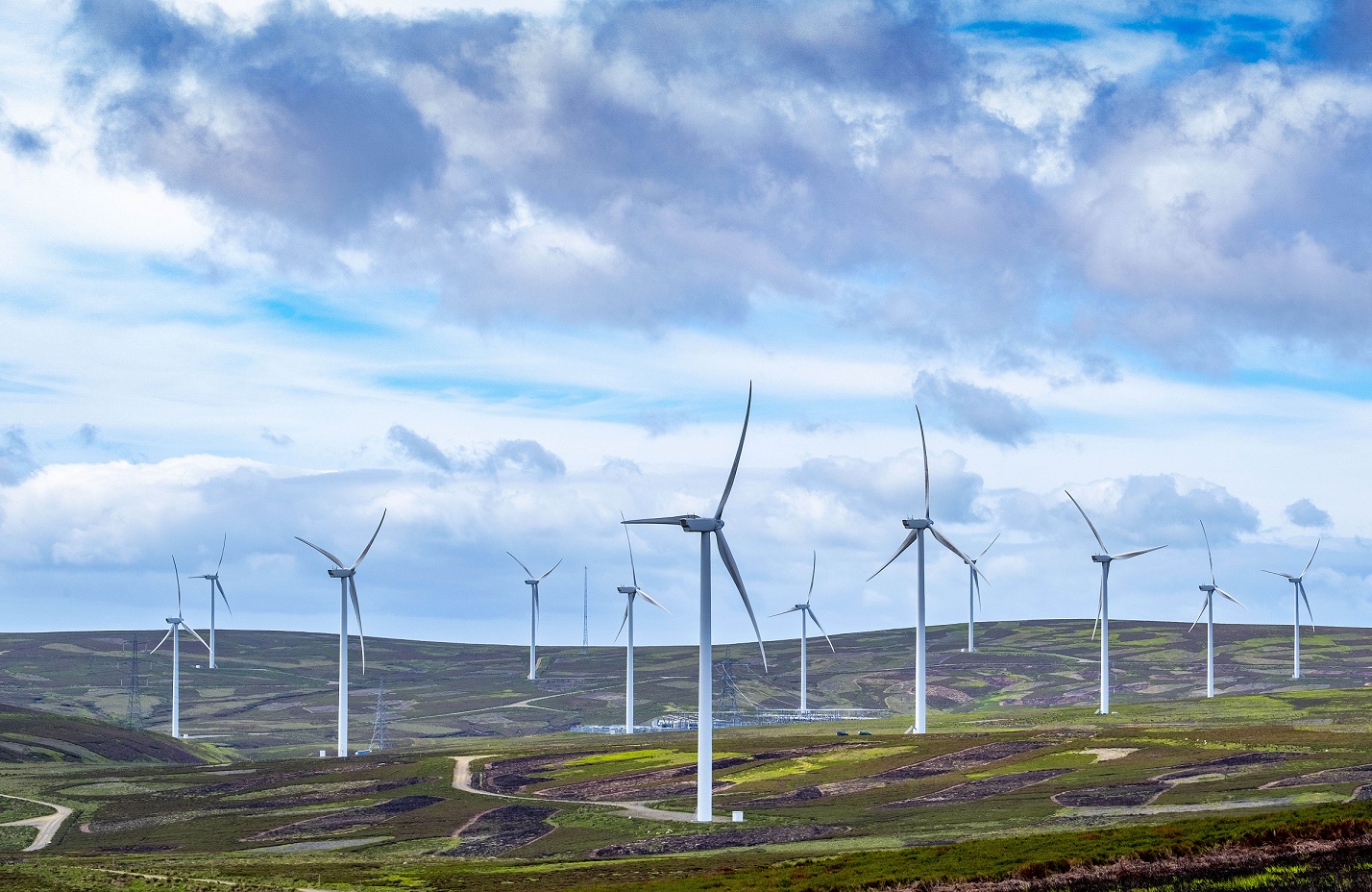 wind farm on hills with a number of turbines